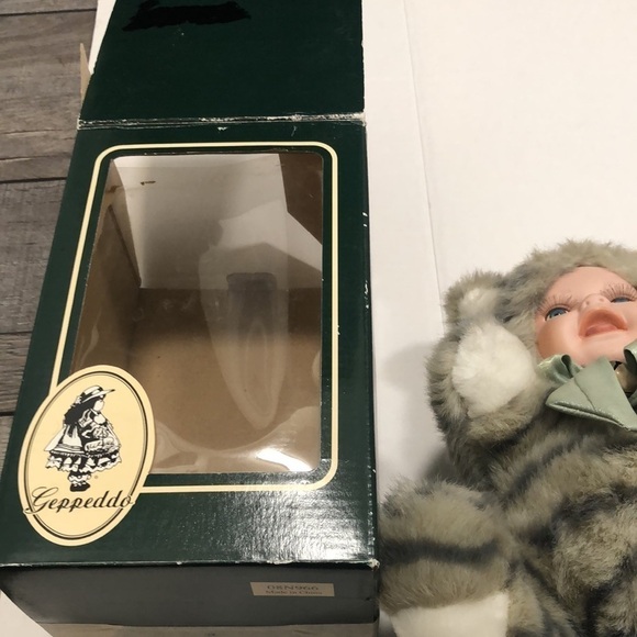 Geppeddo porcelain doll with a cat outfit that is striped and sage bow with bell - Picture 8 of 8